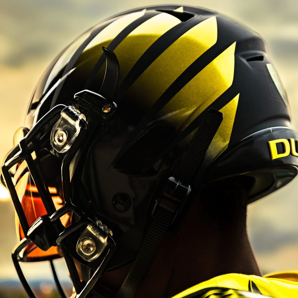 Yellow uniforms with black/fierce Duck logo helmet for Georgia