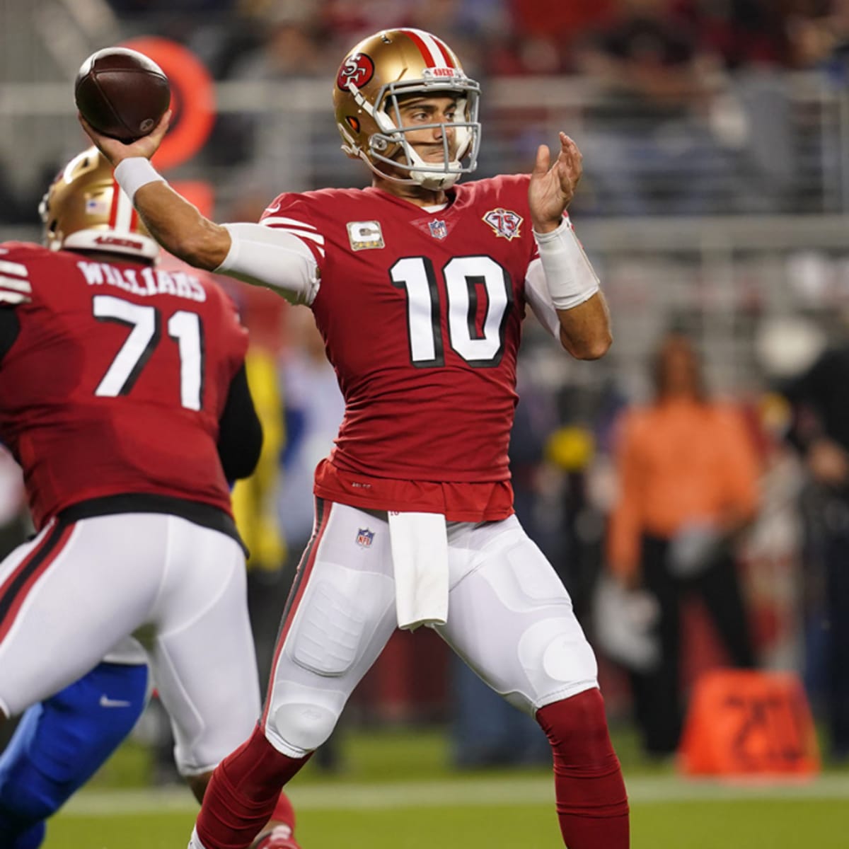 San Francisco 49ers quarterback Jimmy Garoppolo, right, greets players  during warm-ups before an NFL football game against the New York Giants,  Sunday, Sept. 27, 2020, in East Rutherford, N.J. (AP Photo/Bill Kostroun