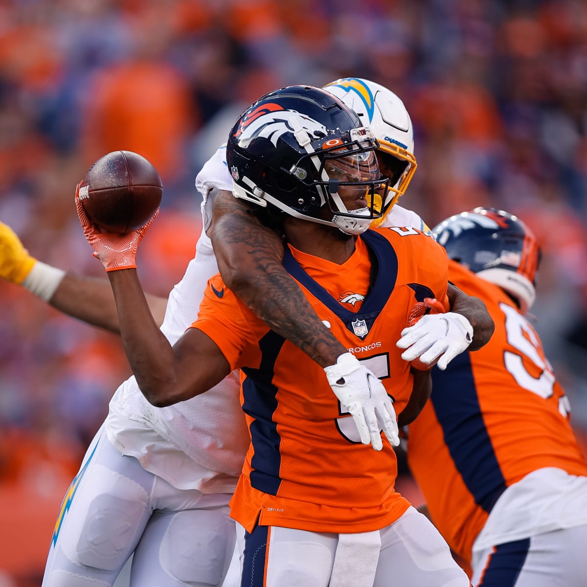 Interceptions lead to Chargers' 28-13 loss to Broncos