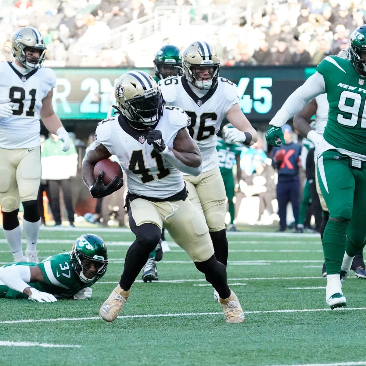 NFC running back Alvin Kamara of the New Orleans Saints (41) runs the ball  past AFC outside linebacker T.J. Watt of the Pittsburgh Steelers (90)  during the Pro Bowl NFL football game