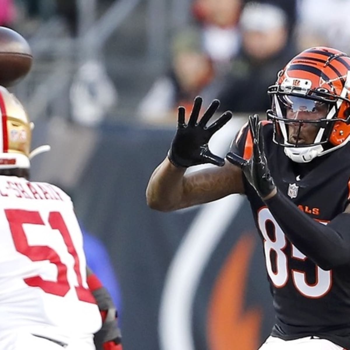 Cincinnati Bengals' Tee Higgins catches a ball practice Thursday