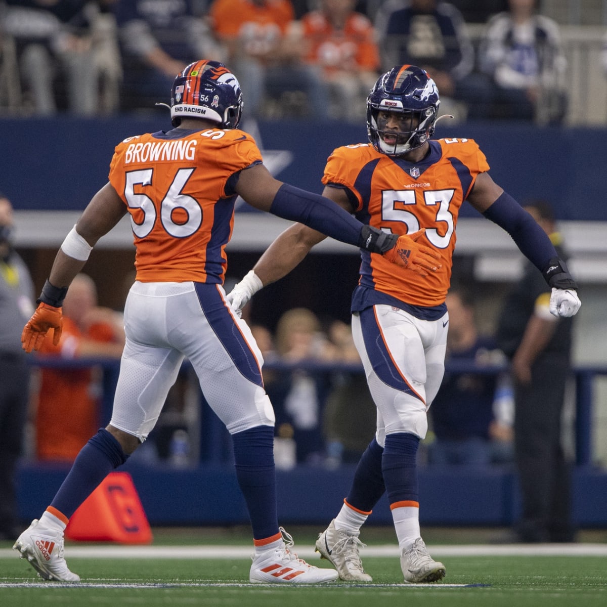 Bulldogs in the NFL - Image 34: Cleveland Browns running back Nick Chubb  (left) and his cousin Denver Broncos outside linebacker Bradley Chubb  (right) exchange jerseys following the game at Broncos Stadium