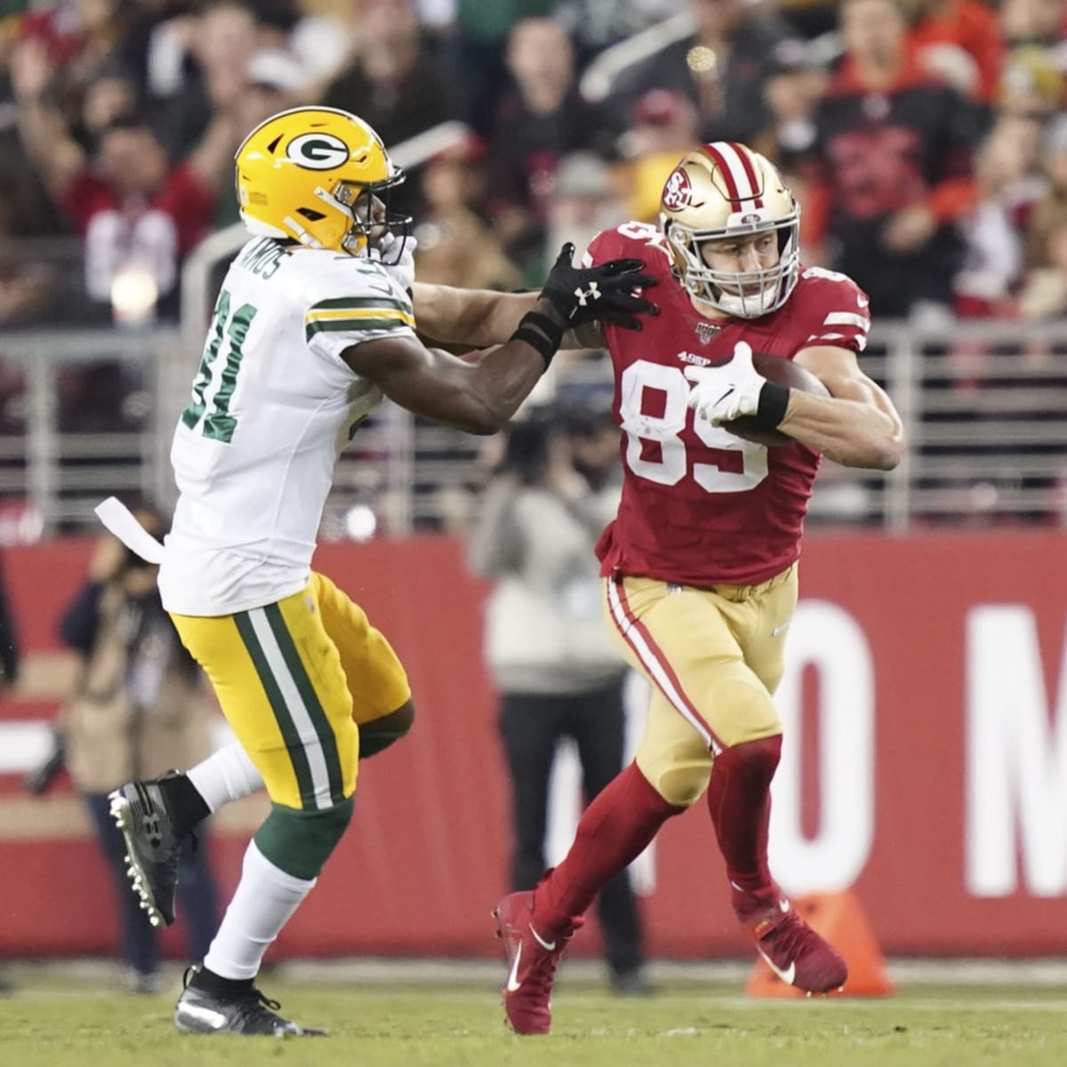 San Francisco 49ers tight end George Kittle runs the ball after a