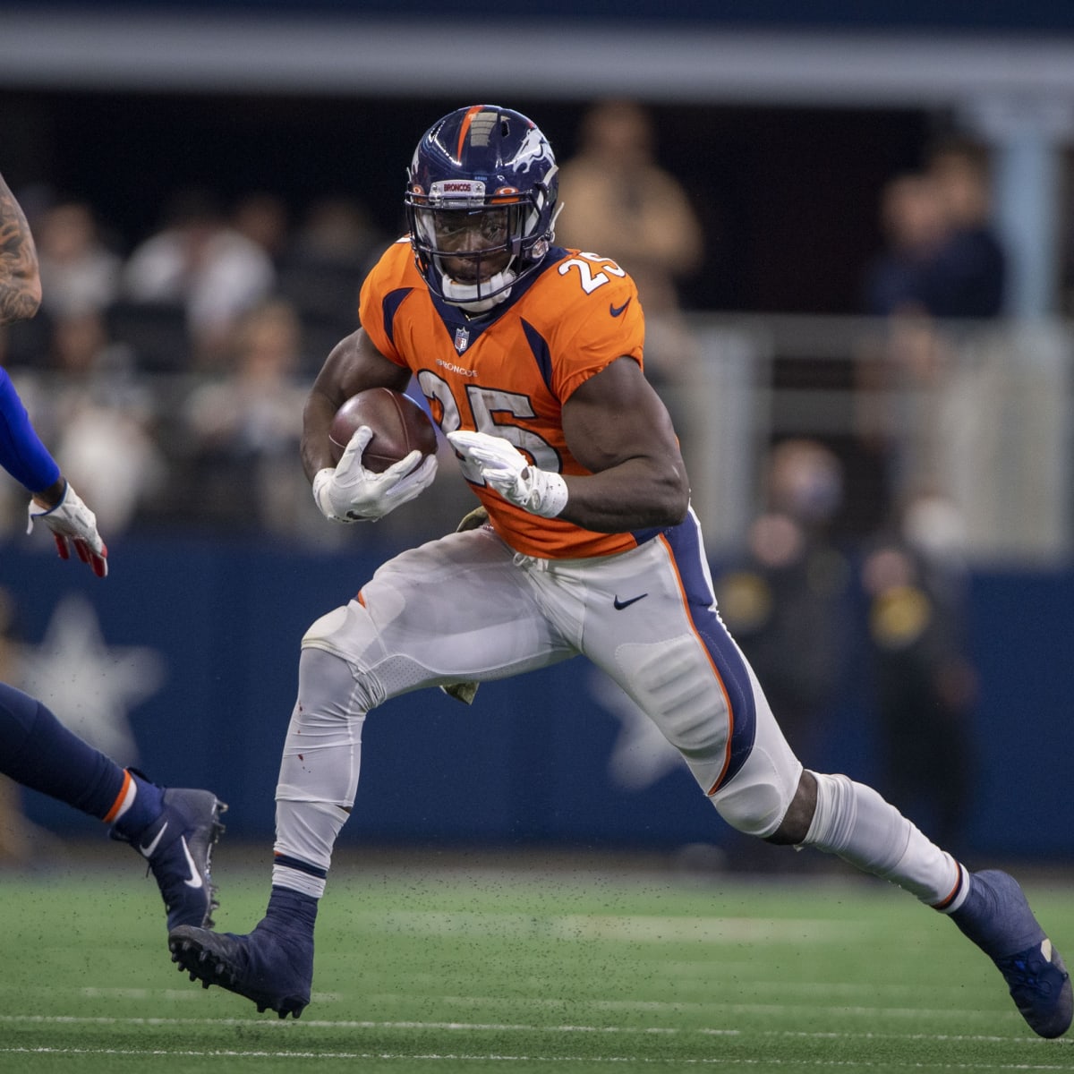 DENVER, CO - OCTOBER 23: New York Jets running back Michael Carter walks on  the sidelines before a NFL game between the New York Jets and the Denver  Broncos on October 23