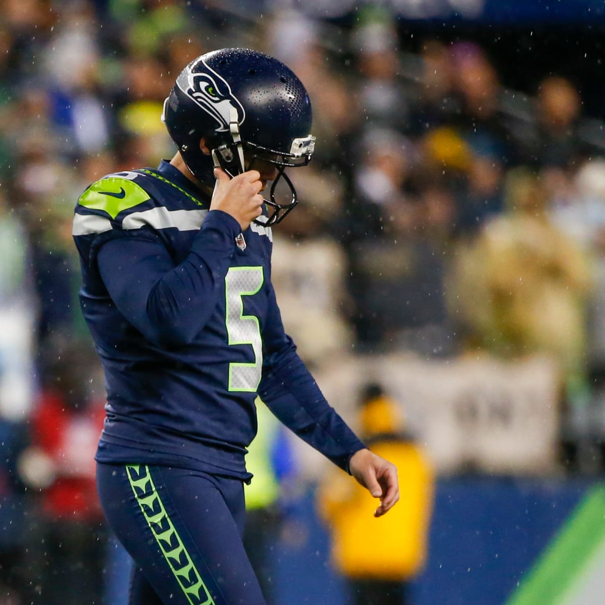 Seattle Seahawks place kicker Jason Myers (5) runs down the field