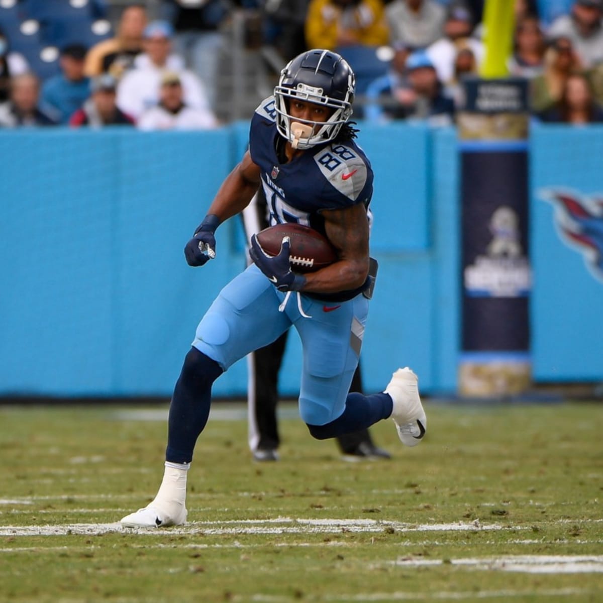 27 September 2009: Tennessee Titans #28 Chris Johnson gets caught. The New  York Jets defeated the Tennessee Titans 24-17 at Giants Stadium in  Rutherford, New Jersey. In honor of AFL Legacy weekend