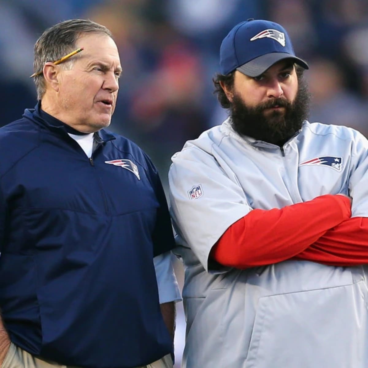 New England Patriots assistant coach Matt Patricia makes a play call on the  sideline while wearing in Italian flag on his shirt during the first half  of an NFL football game against