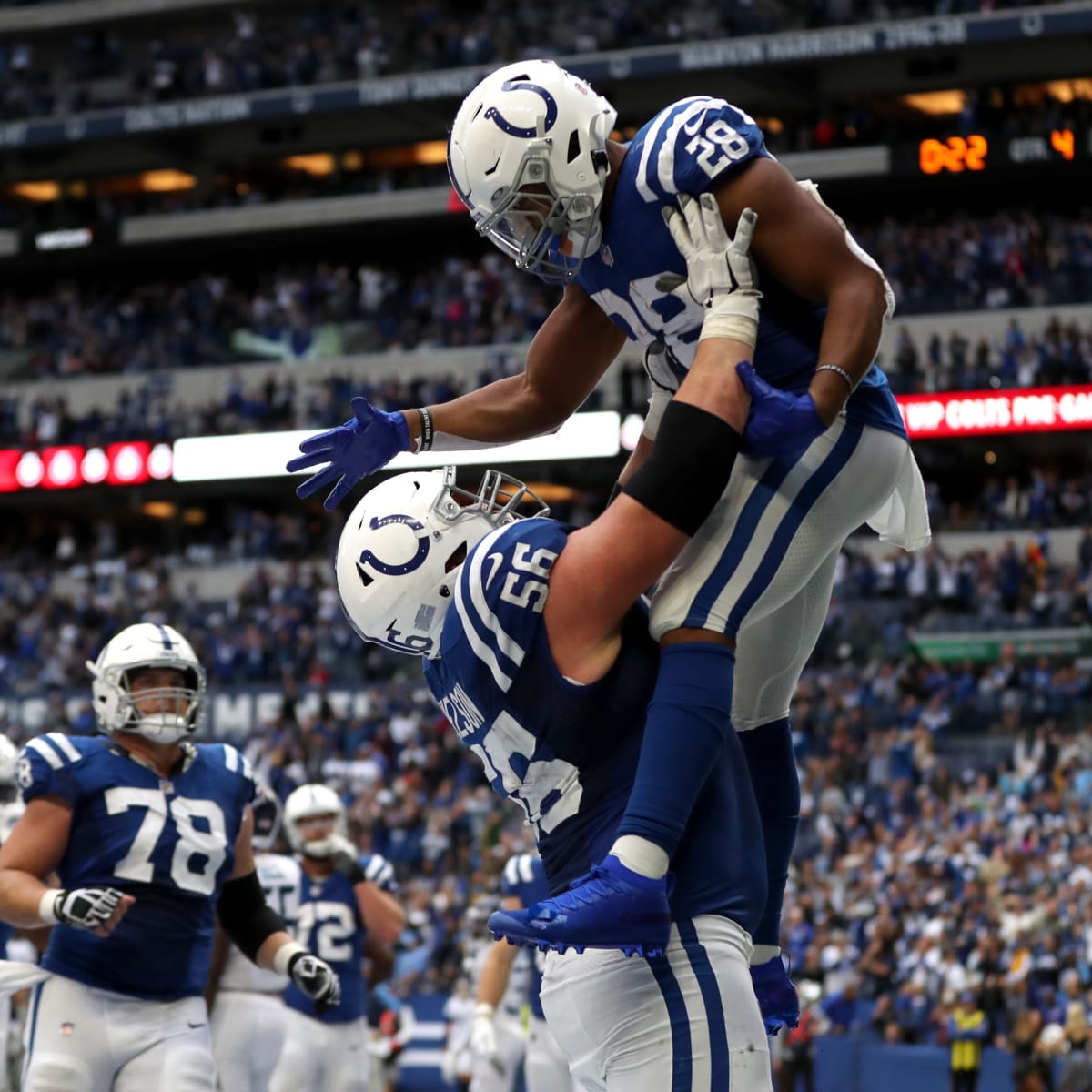 Indianapolis Colts guard Mark Glowinski (64) walks back to the huddle  during an NFL football game