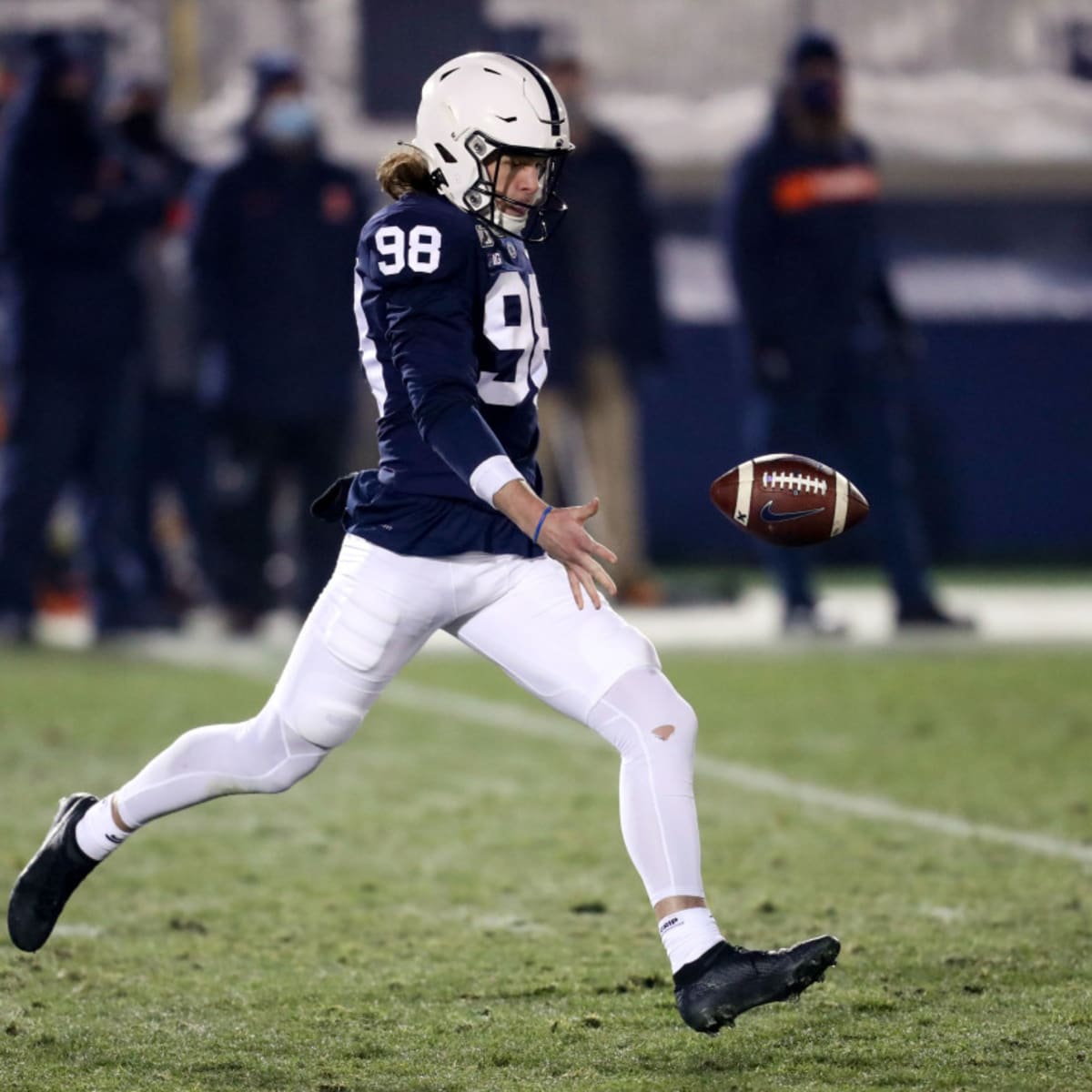 Ravens special teams consultant Sam Koch coaches up P Jordan Stout