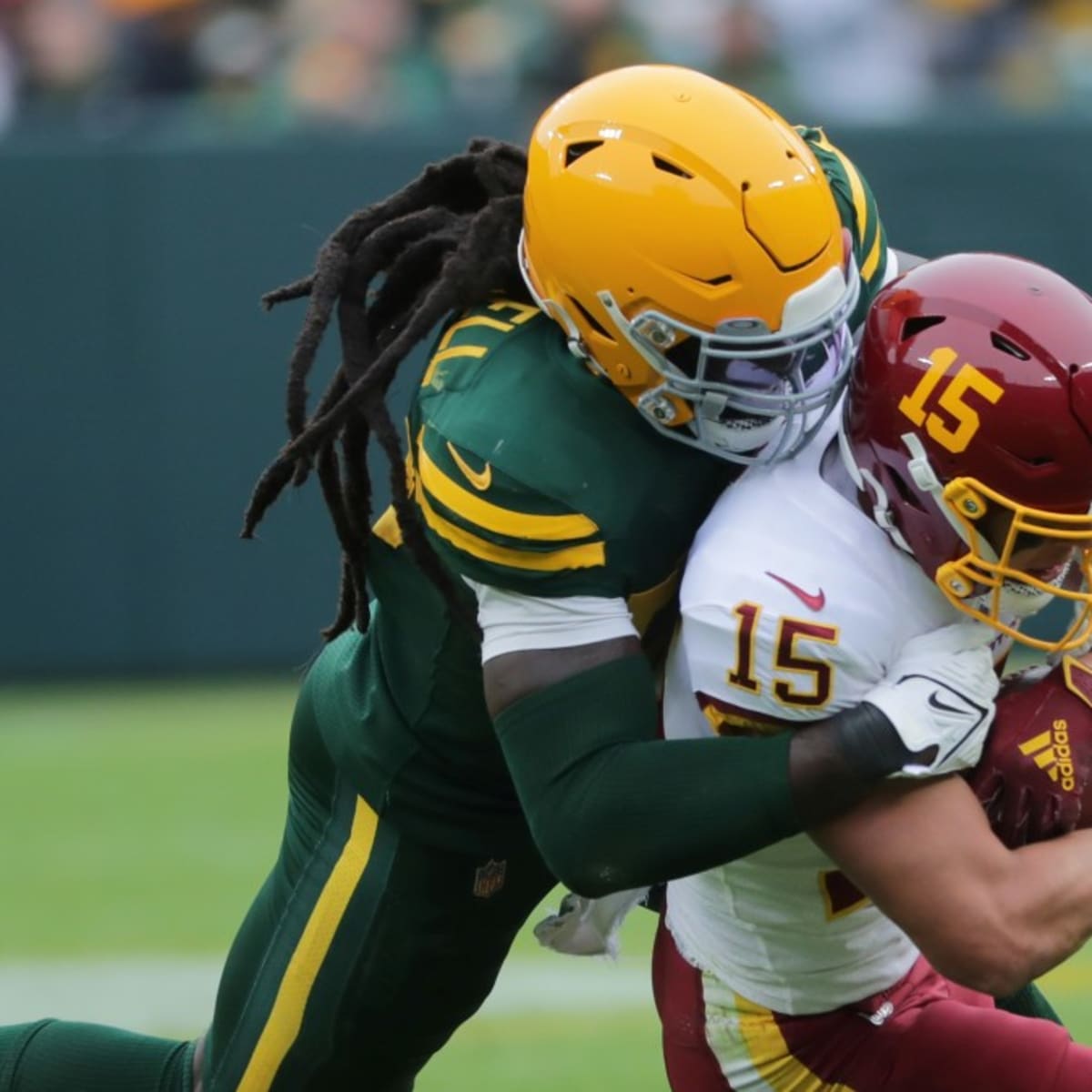 Green Bay Packers' De'Vondre Campbell and Quay Walker run onto the field at  the NFL football team's practice field Saturday, July 30, 2022, in Green Bay,  Wis. (AP Photo/Morry Gash Stock Photo 