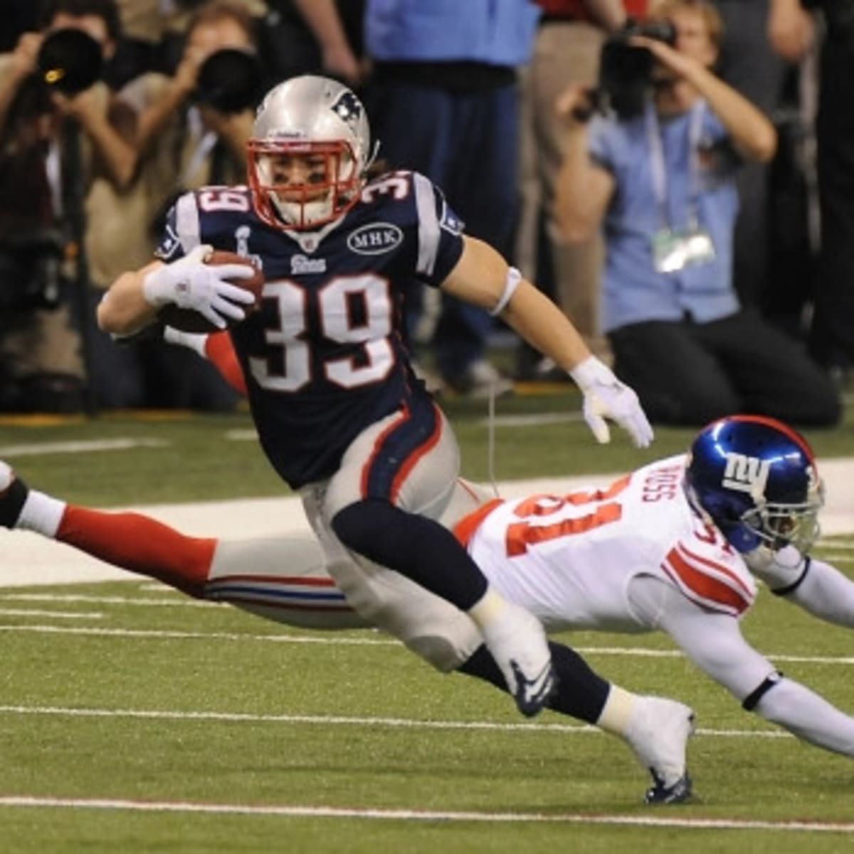 Running back Danny Woodhead (39) of the New England Patriots celebrates his  touchdown catch in the closing seconds of the first half against the New  York Giants during Superbowl XLVI on Sunday