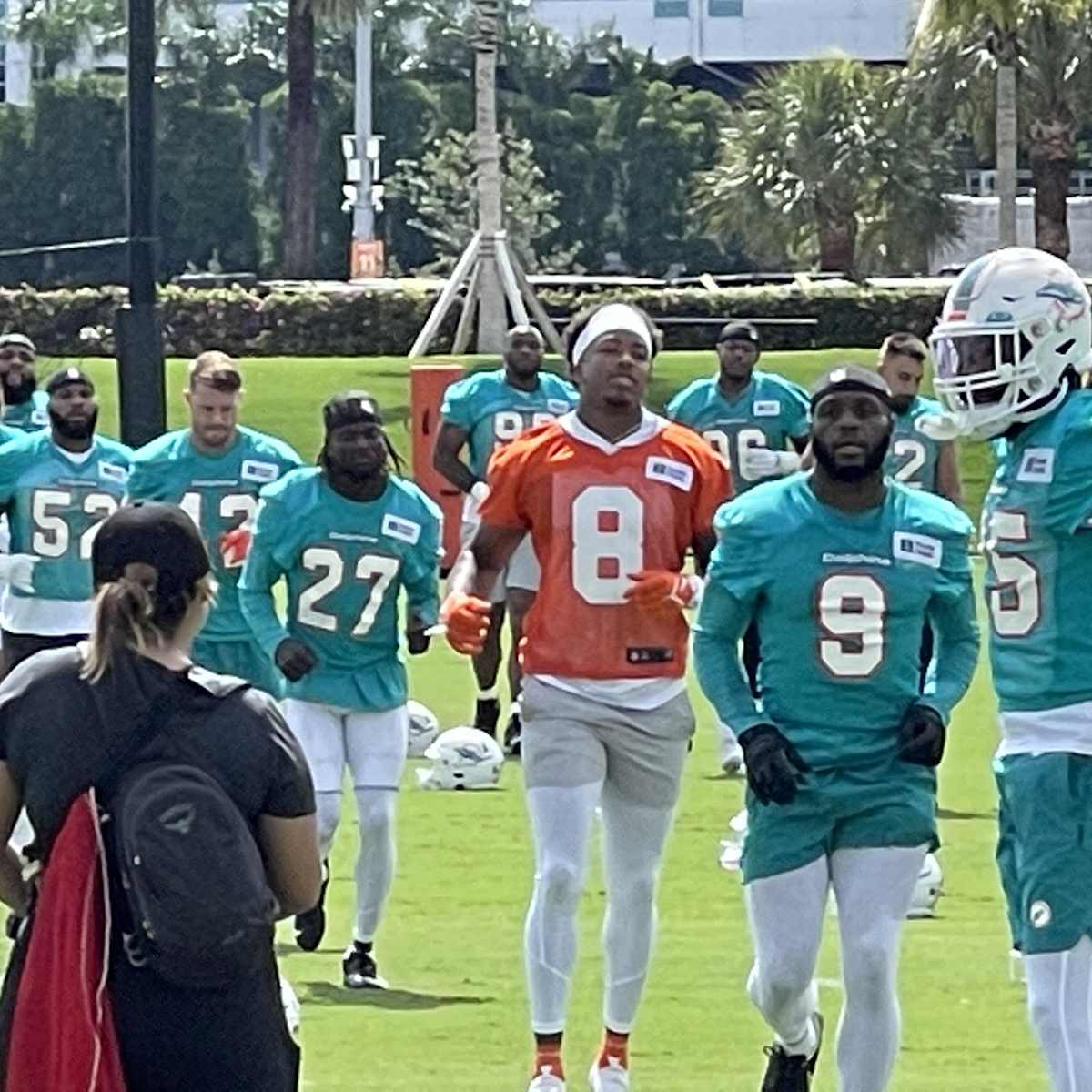 Miami Dolphins wide receiver Erik Ezukanma (18) runs with the football  during NFL football practice at Baptist Health Training Complex in Hard  Rock Stadium on Wednesday, Sept. 14, 2022 in Miami Gardens