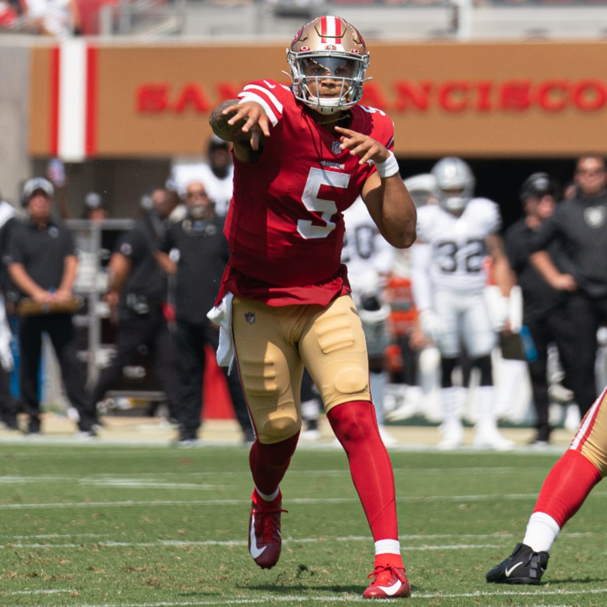 Trey Lance of the San Francisco 49ers passes against Malcolm