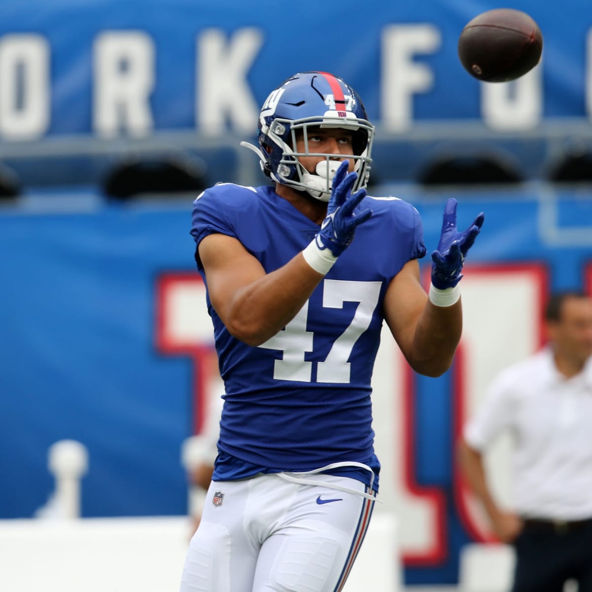 New York Giants linebacker Cam Brown (47) runs off the field