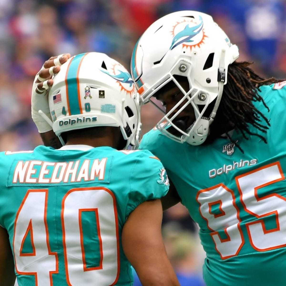 Miami Dolphins defensive tackle John Jenkins (77) walks off the