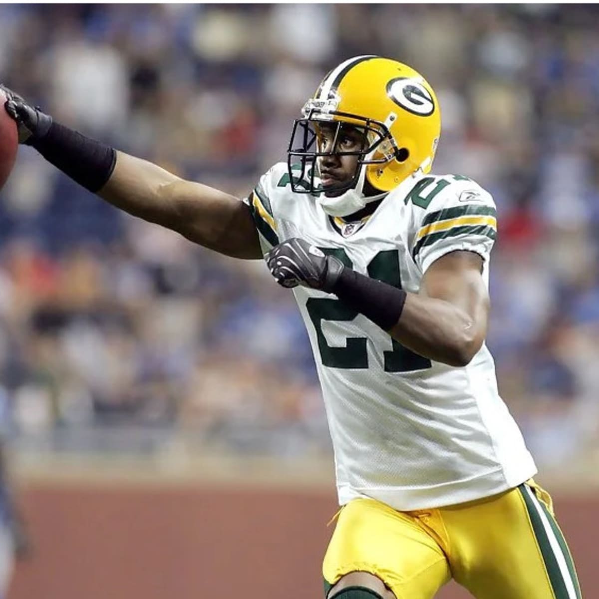 Green Bay Packers' Charles Woodson shouts instructions to teammates during  the second half of an NFL football game against the Chicago Bears Sunday,  Sept. 13, 2009, in Green Bay, Wis. The Packers