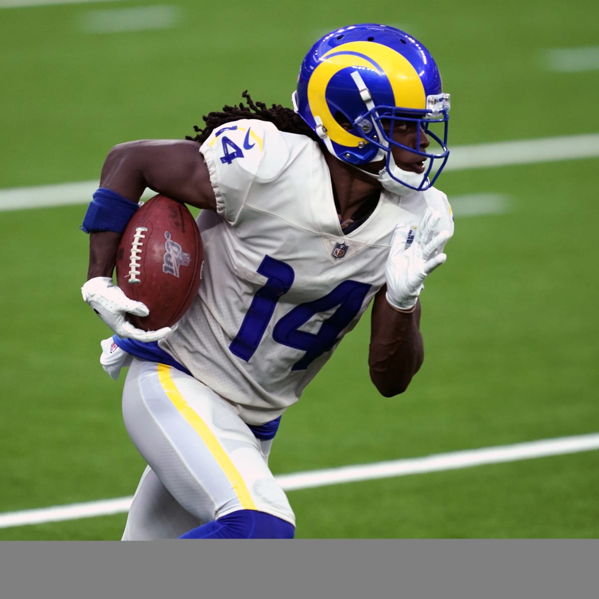 Los Angeles Rams' Nsimba Webster, left, rushes against the Oakland Raiders  during the second ha …