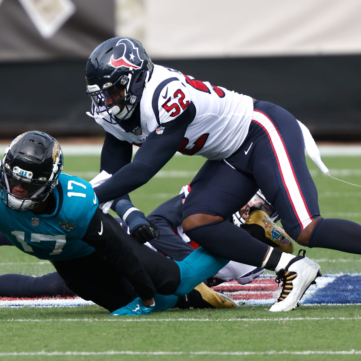 Houston Texans defensive lineman Jonathan Greenard (52) walks on the  sidelines during an NFL football game against the Miami Dolphins, Sunday  Nov. 7, 2021, in Miami Gardens, Fla. (AP Photo/Doug Murray Stock