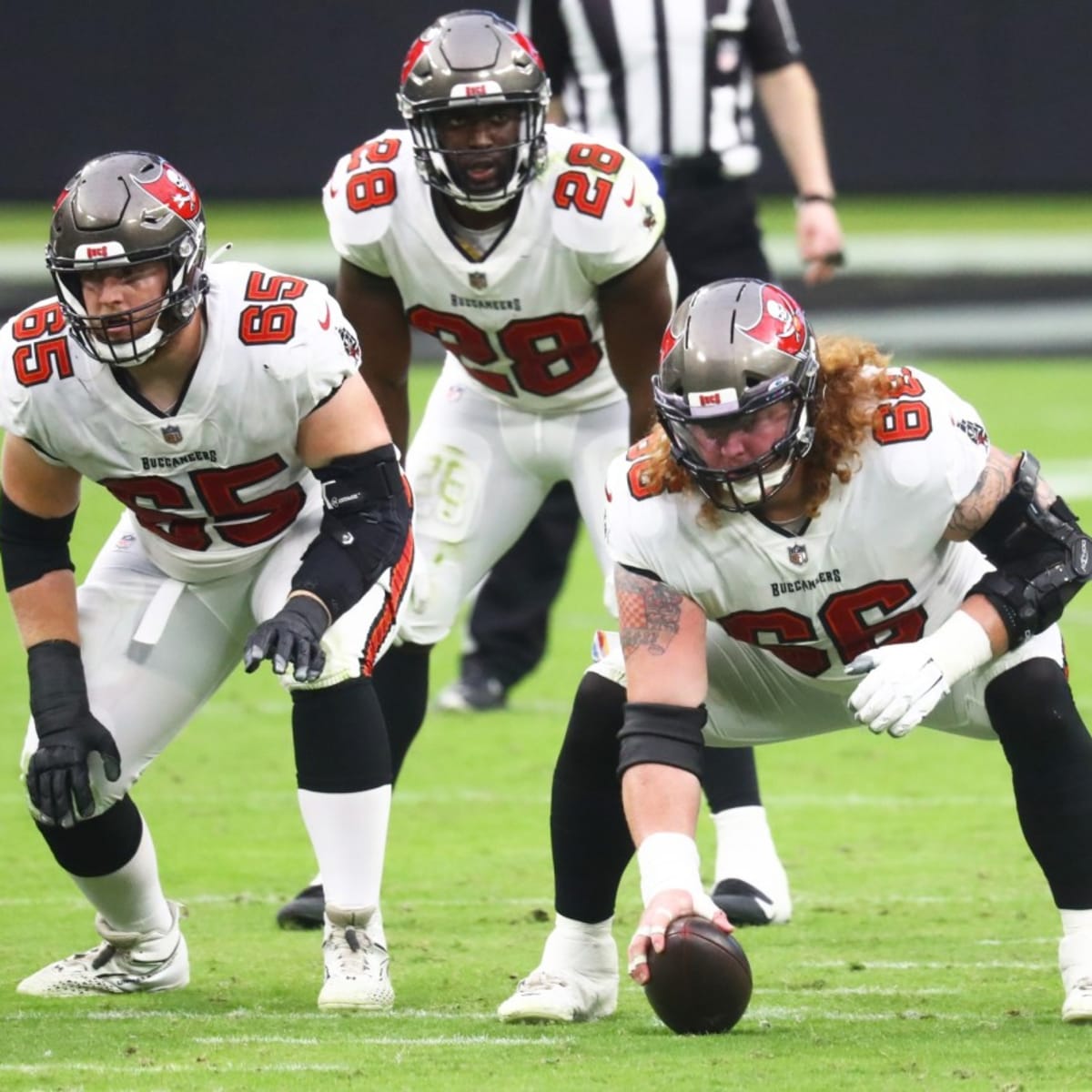 Tampa Bay Buccaneers guard Alex Cappa (65) reacts to the snap during a NFL  divisional playoff f …