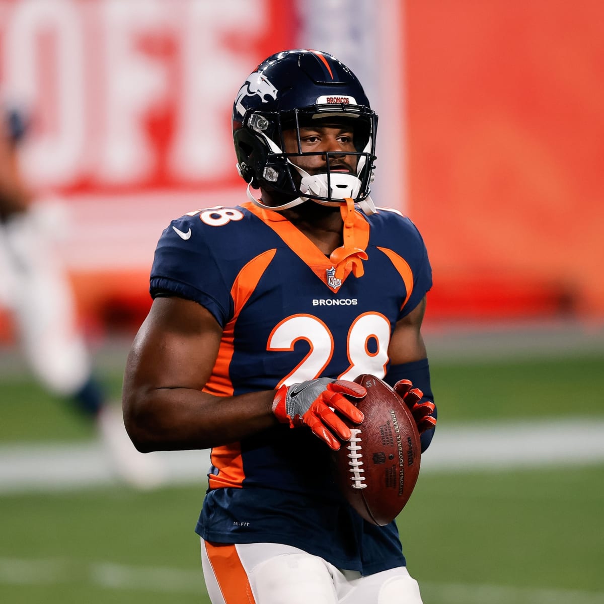 Denver Broncos running back Royce Freeman (28) rushes with the ball as he  eyes a defender during an NFL football game, Monday, Sept. 9, 2019, in  Oakland, Calif. (AP Photo/Peter Joneleit Stock