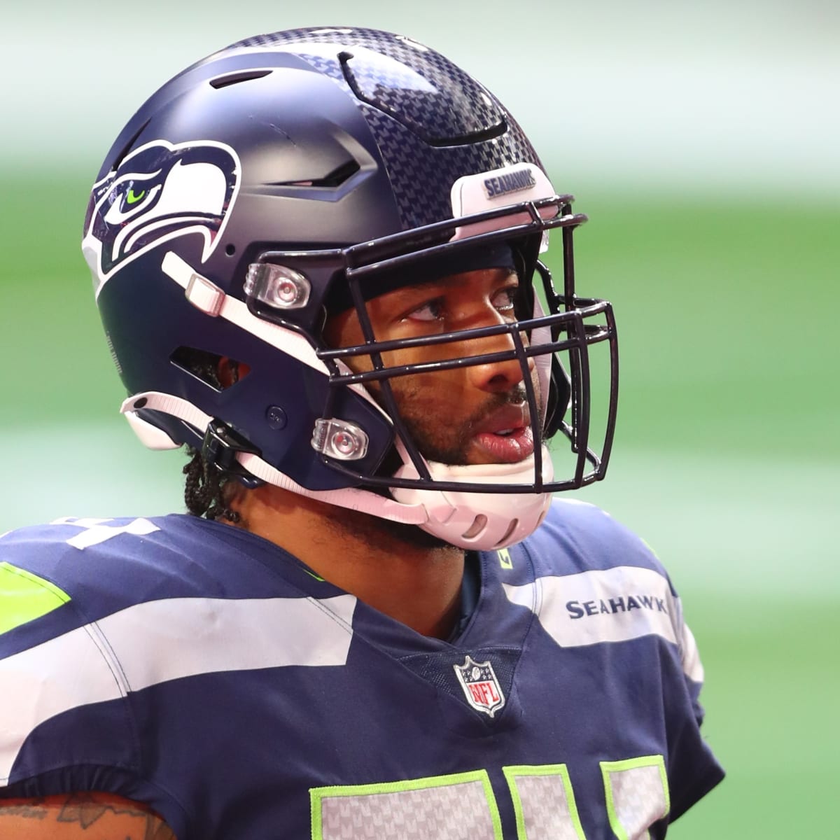 Seattle Seahawks tight end Colby Parkinson (84) puts his helmet on during  an NFL football game against the Los Angeles Chargers, Sunday, Oct. 23,  2022, in Inglewood, Calif. (AP Photo/Kyusung Gong Stock