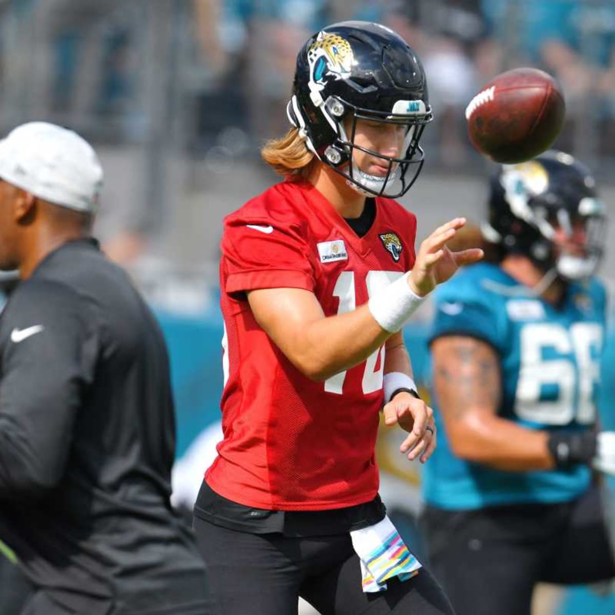 Jacksonville Jaguars quarterback Trevor Lawrence wears a Salute to Service  hoodie during pre-game warmups before an NFL football game against the  Kansas City Chiefs, Sunday, Nov. 13, 2022 in Kansas City, Mo. (