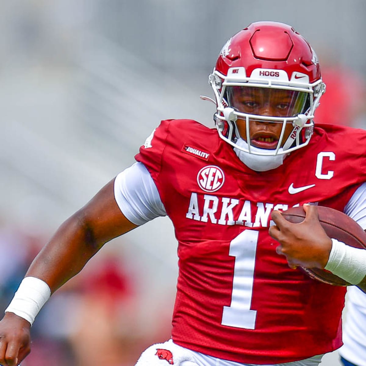 Arkansas quarterback KJ Jefferson wears bowl championship rings