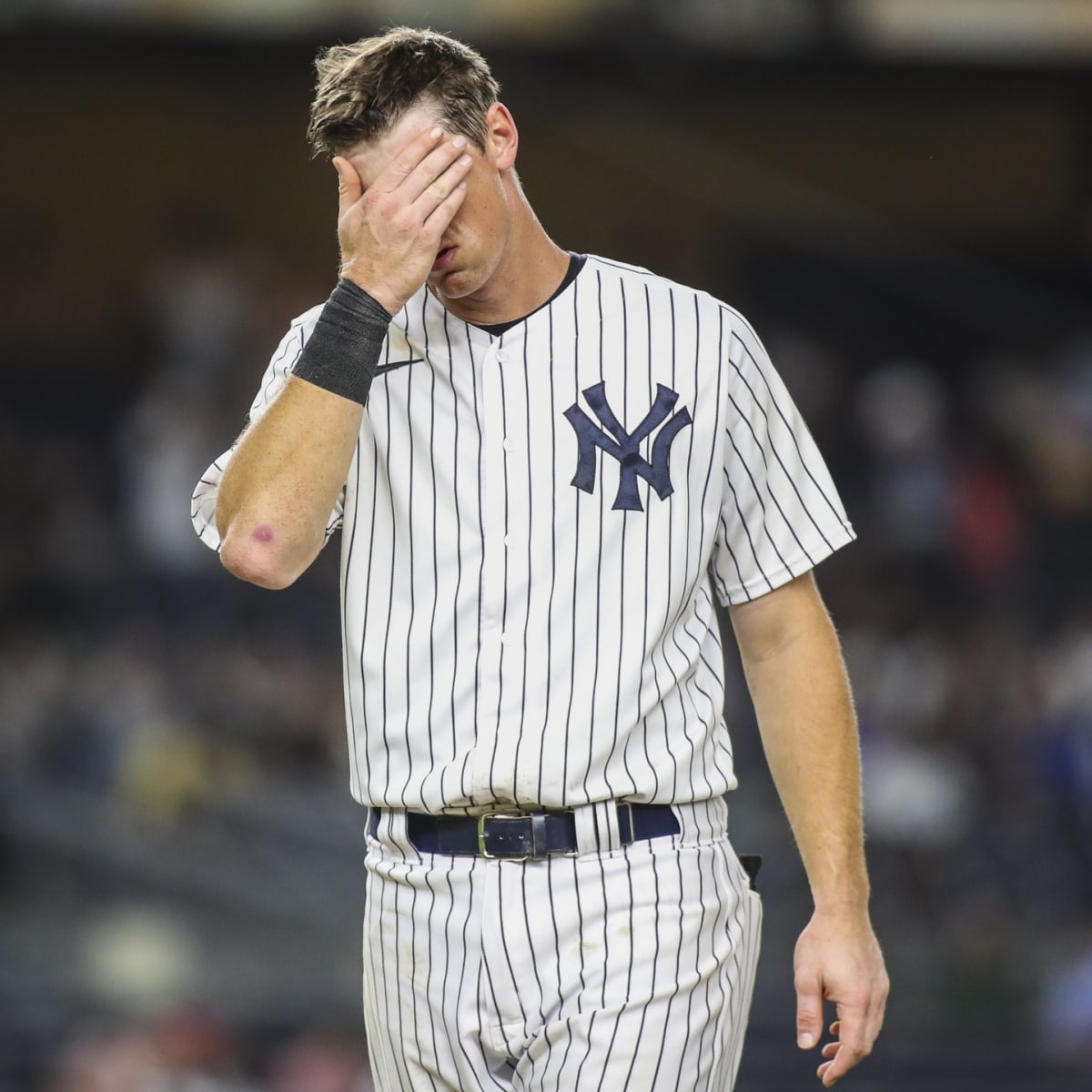 New York Yankees pitcher Sal Romano gives the ball to manager Aaron Boone  against the Toronto Blue Jays during the seventh inning of a baseball game  on Thursday, Sept. 9, 2021, in