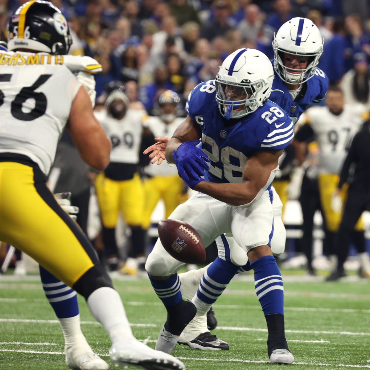 INDIANAPOLIS, IN - OCTOBER 30: Indianapolis Colts running back Jonathan  Taylor (28) fumbles the ball in the 3rd quarter of play during an NFL game  between the Washington Commanders and the Indianapolis