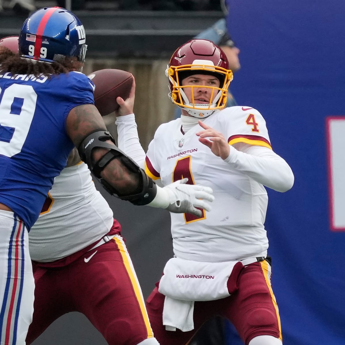 LANDOVER, MD - DECEMBER 18: Washington Commanders quarterback Taylor  Heinicke (4) jogs onto the field prior to the New York Giants game versus  the Washington Commanders on December 18, 2022, at FedEx