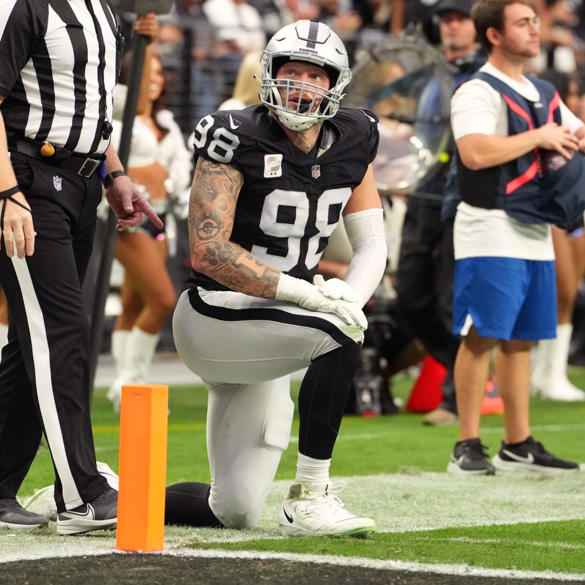 Raiders defensive end Maxx Crosby (98) sacks Los Angeles Chargers  quarterback Justin Herbert (1 …