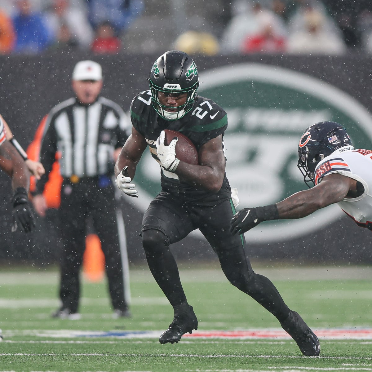 New York Jets running back Zonovan Knight (27) carries the ball against the  Chicago Bears during an NFL football game, Sunday, Nov. 27, 2022, in East  Rutherford, N.J. (AP Photo/Seth Wenig Stock