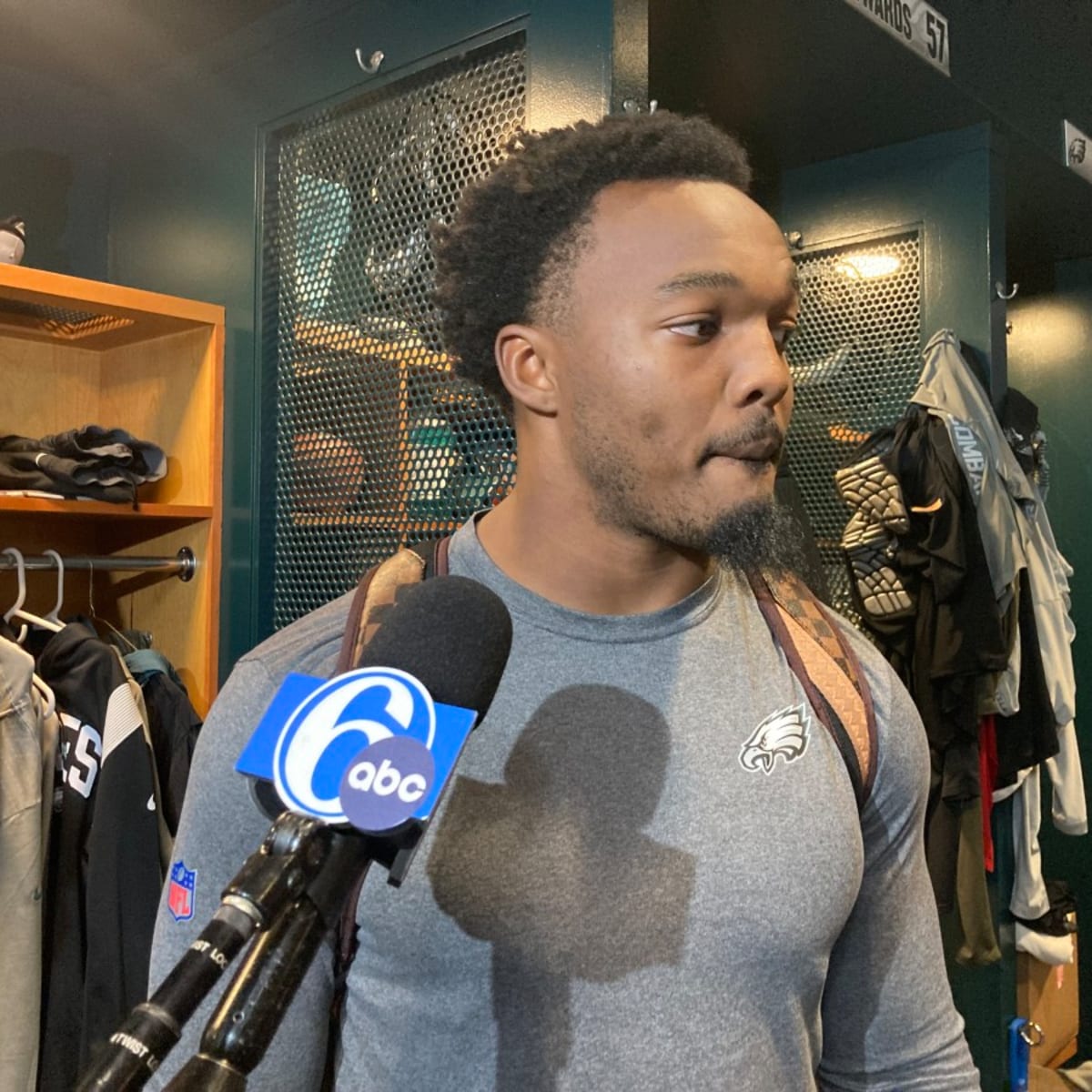 Eagles linebacker Kyzir White goes to bat for rookie Nakobe Dean