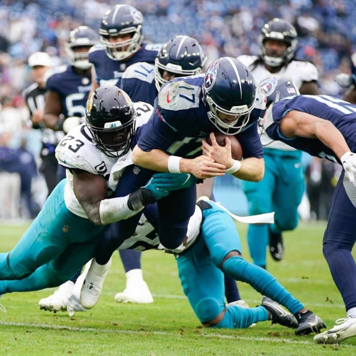 From left, Jacksonville Jaguars' Luke Fortner (79), Tyler Shatley (69), and  offensive tackle Walker Little (72) in action during an NFL football game  against the Tennessee Titans, Saturday, Jan. 7, 2023, in