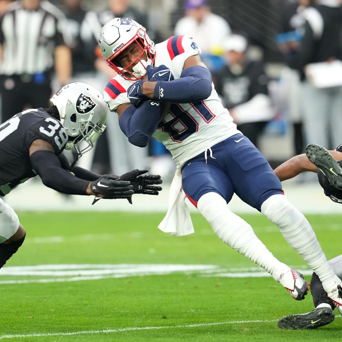 The Las Vegas Raiders, left, face off at the line of scrimmage against the  New England Patriots in the first half of an NFL football game, Sunday,  Sept. 27, 2020, in Foxborough