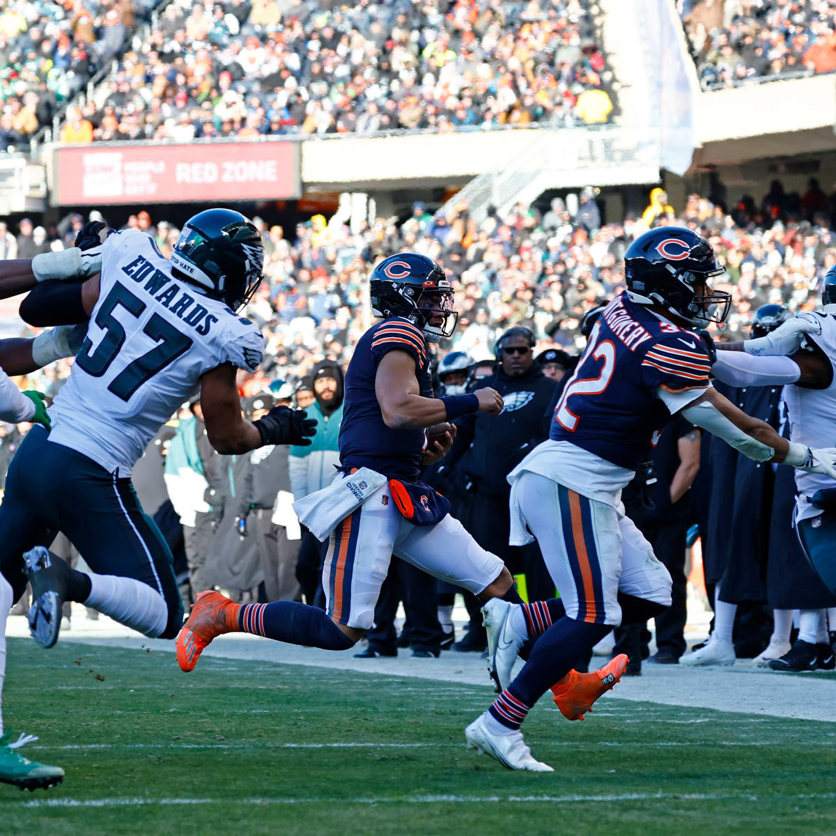 Chicago, United States. 18th Dec, 2022. Philadelphia Eagles quarterback  Jalen Hurts (1) hands off the ball to Philadelphia Eagles running back  Miles Sanders (26) during a game against the Chicago Bears at