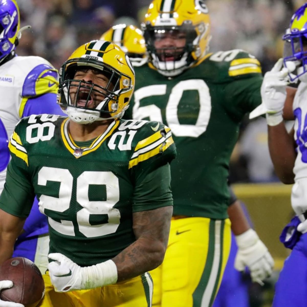 AJ Dillon helps Packers beat Rams to keep playoff hopes alive