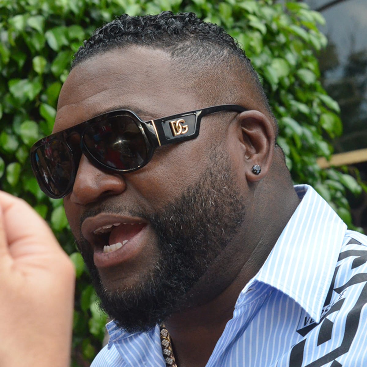 The Dominican Republic's designated hitter David Ortiz waves his country's  flag after helping defeat Venezuela, 11-5, during their Round 1 World  Baseball Classic game in Lake Buena Vista, Fla., Tuesday, March 7