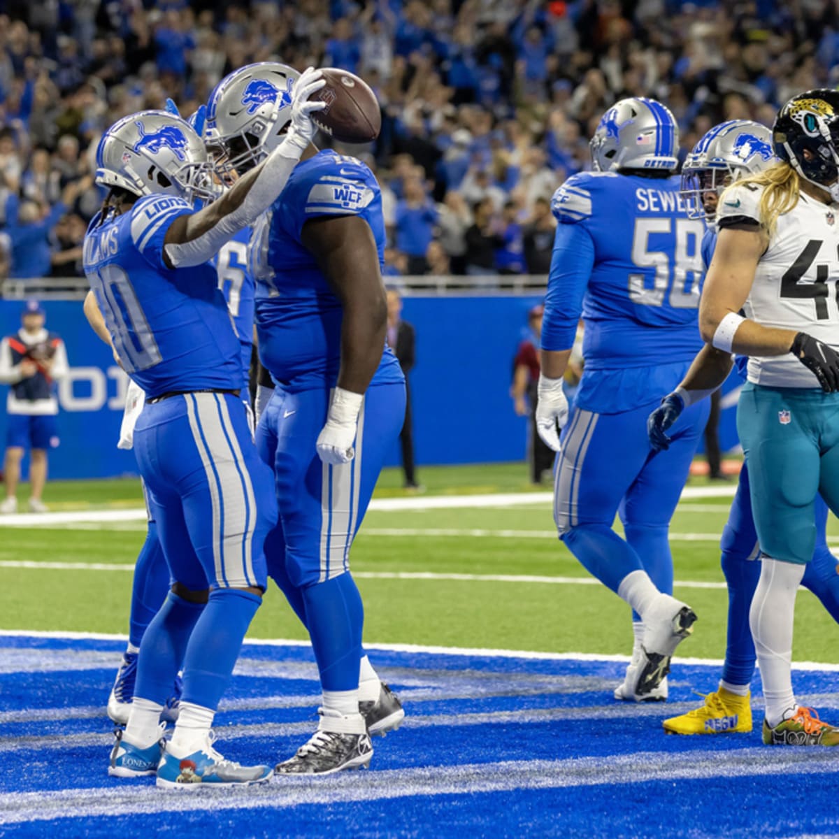 Detroit Lions guard Kayode Awosika (74) reacts at the conclusion