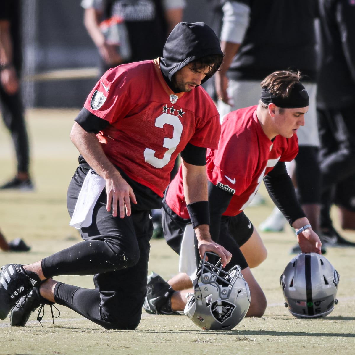 Las Vegas Raiders quarterback Jarrett Stidham is tackled by Minnesota  Vikings defensive tackle T.Y. McGill during the first half of an NFL  preseason football game, Sunday, Aug. 14, 2022, in Las Vegas. (