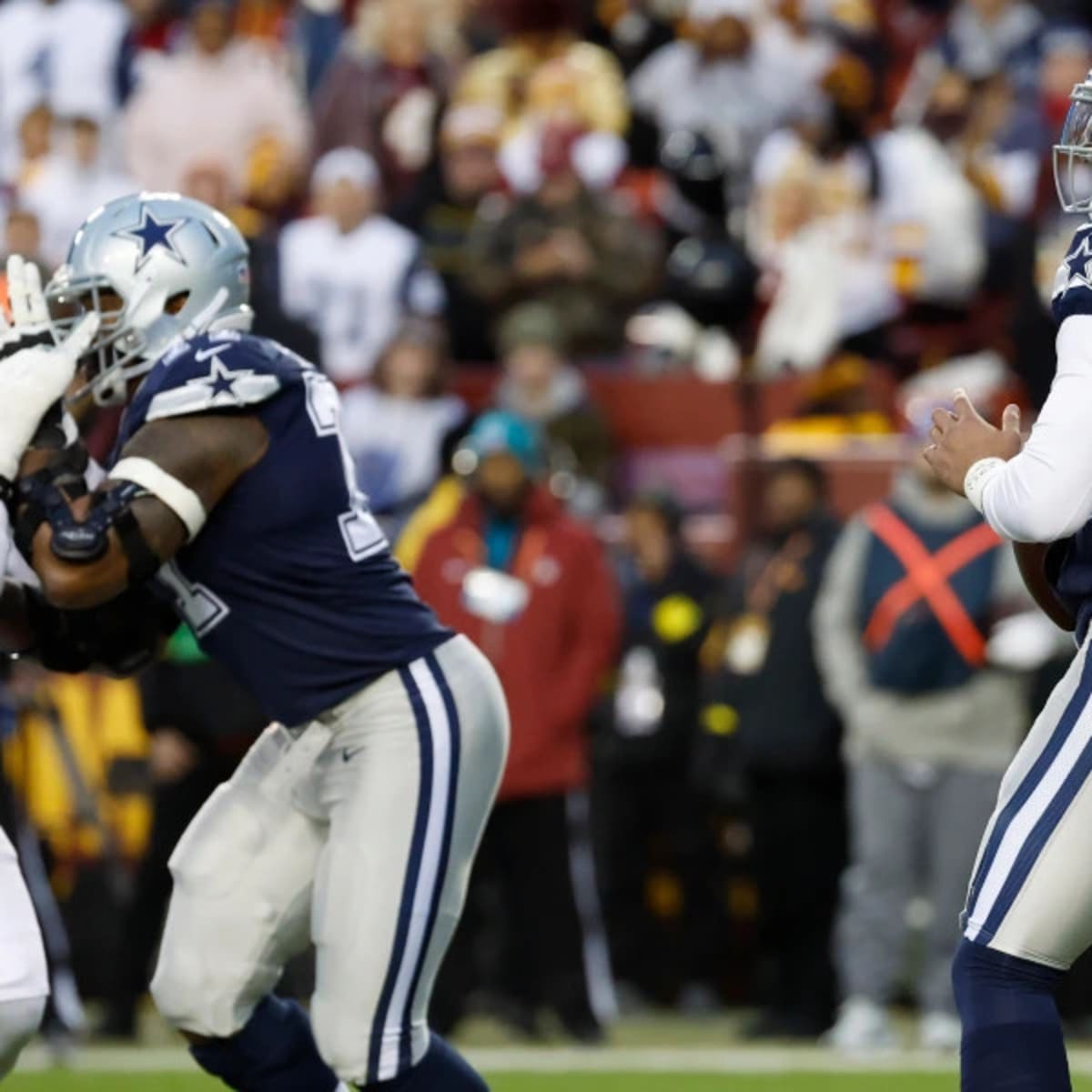 January 8, 2023 : Washington Commanders linebacker Khaleke Hudson (47)  applies pressure to Dallas Cowboys quarterback Dak Prescott (4) during the  game between the Dallas Cowboys and the Washington Commanders in Landover