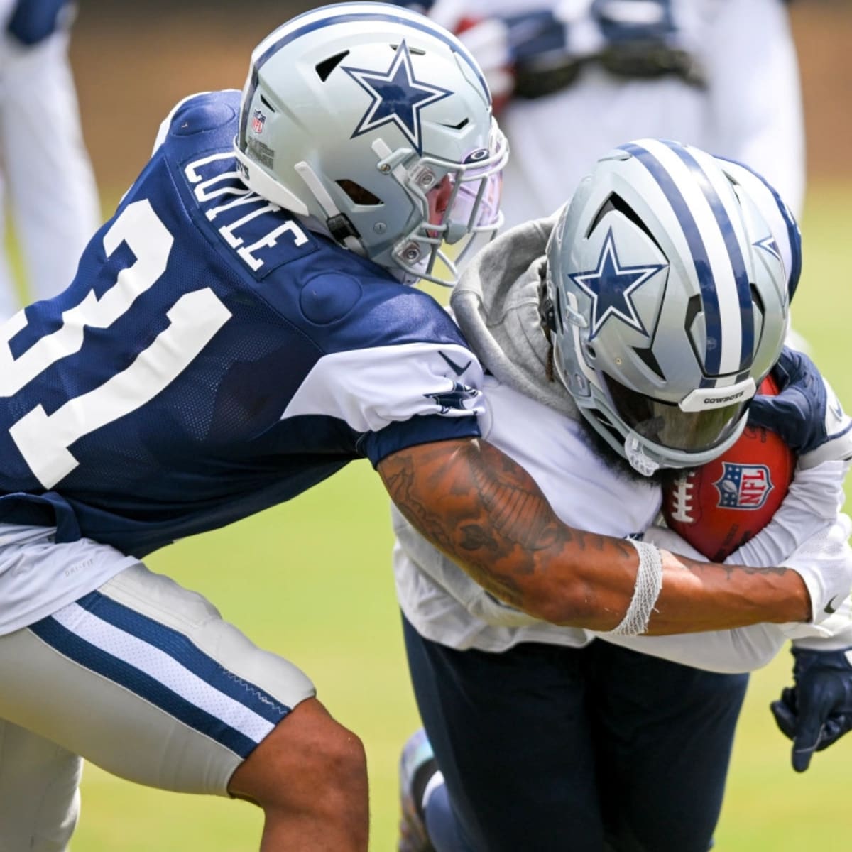 Dallas Cowboys safety Tyler Coyle attempts to prevent a touchback on a punt  during the second half of the Pro Football Hall of Fame NFL preseason game  against the Pittsburgh Steelers, Thursday