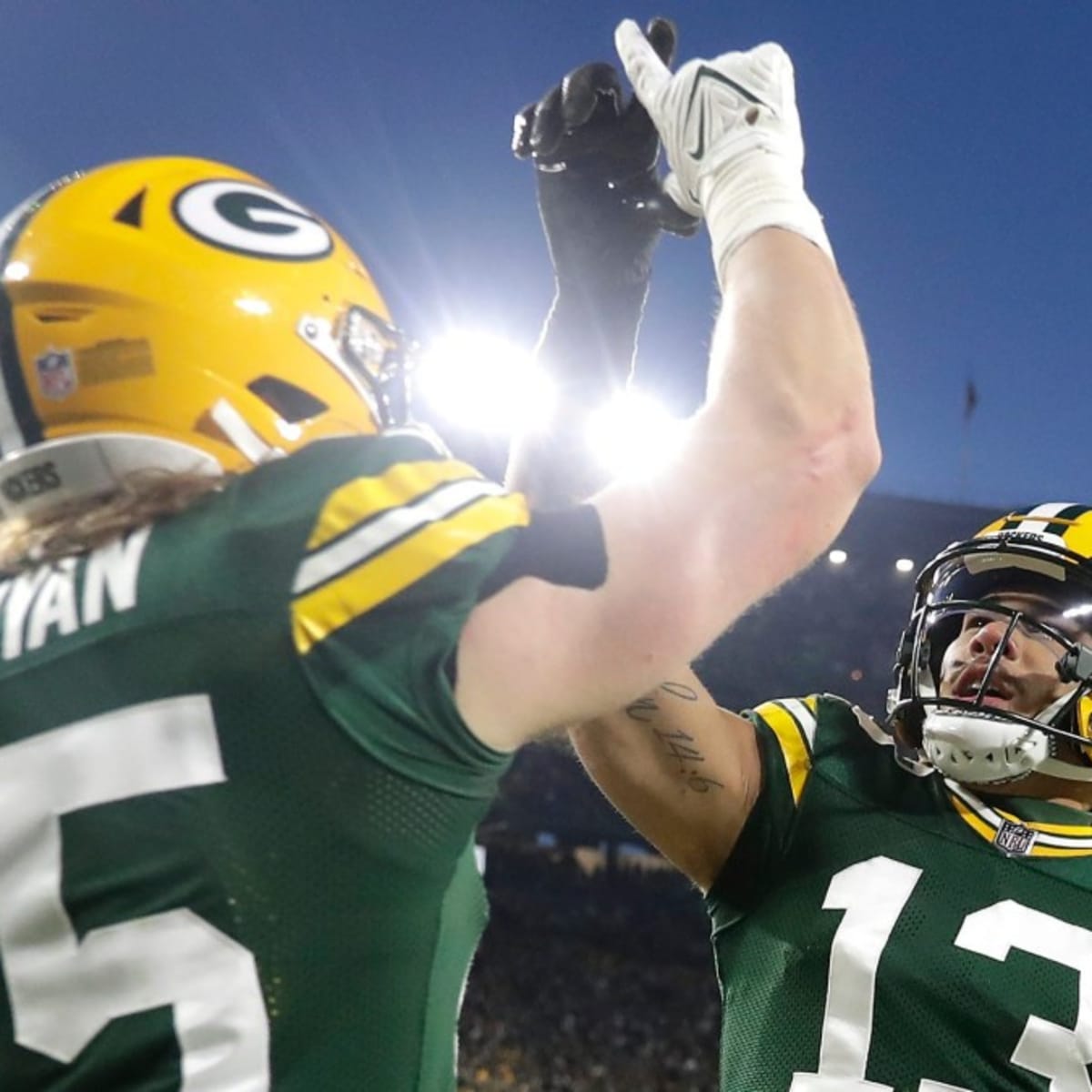 Green Bay, Wisconsin, USA. 02nd Jan, 2022. Green Bay Packers quarterback  Aaron Rodgers #12 congratulates Green Bay Packers wide receiver Allen  Lazard #13 on a touchdown during NFL football game between the