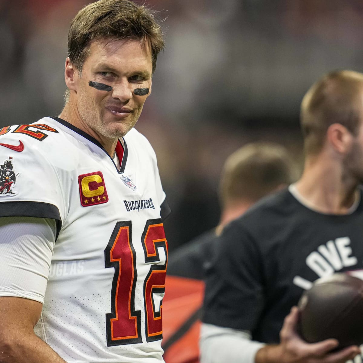 Tom Brady signs last ball he threw as a Patriot, which was intercepted by  his Bucs teammate