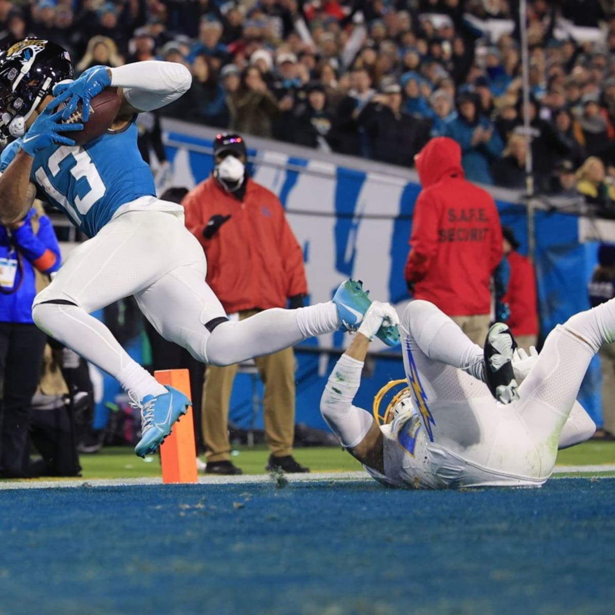 JACKSONVILLE, FL - JANUARY 14: Jacksonville Jaguars cornerback Tre Herndon  (37) runs with the ball during the game between the Los Angeles Chargers  and the Jacksonville Jaguars on January 14, 2023 at