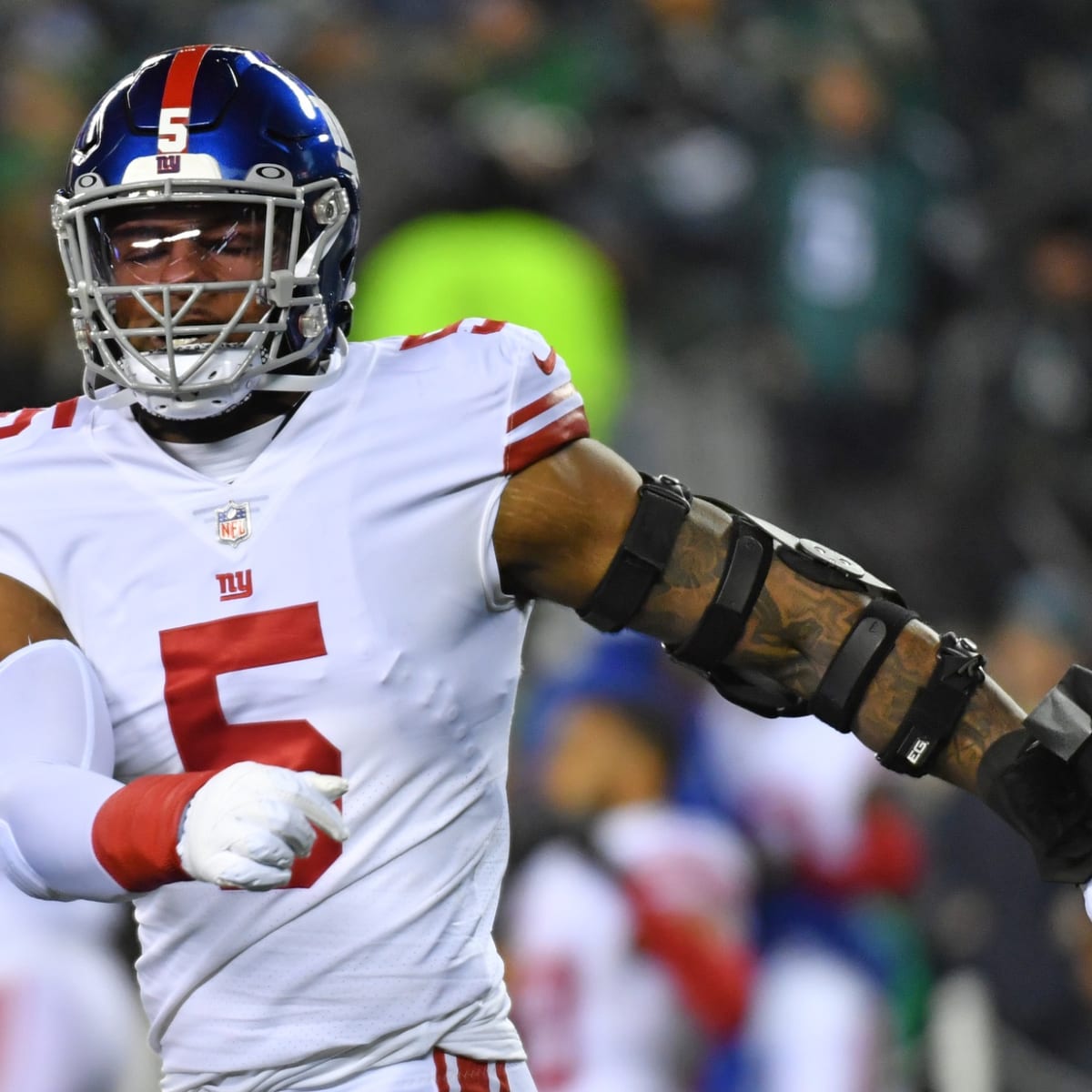 New York Giants Michael Strahan reacts to a sack in week 13 at