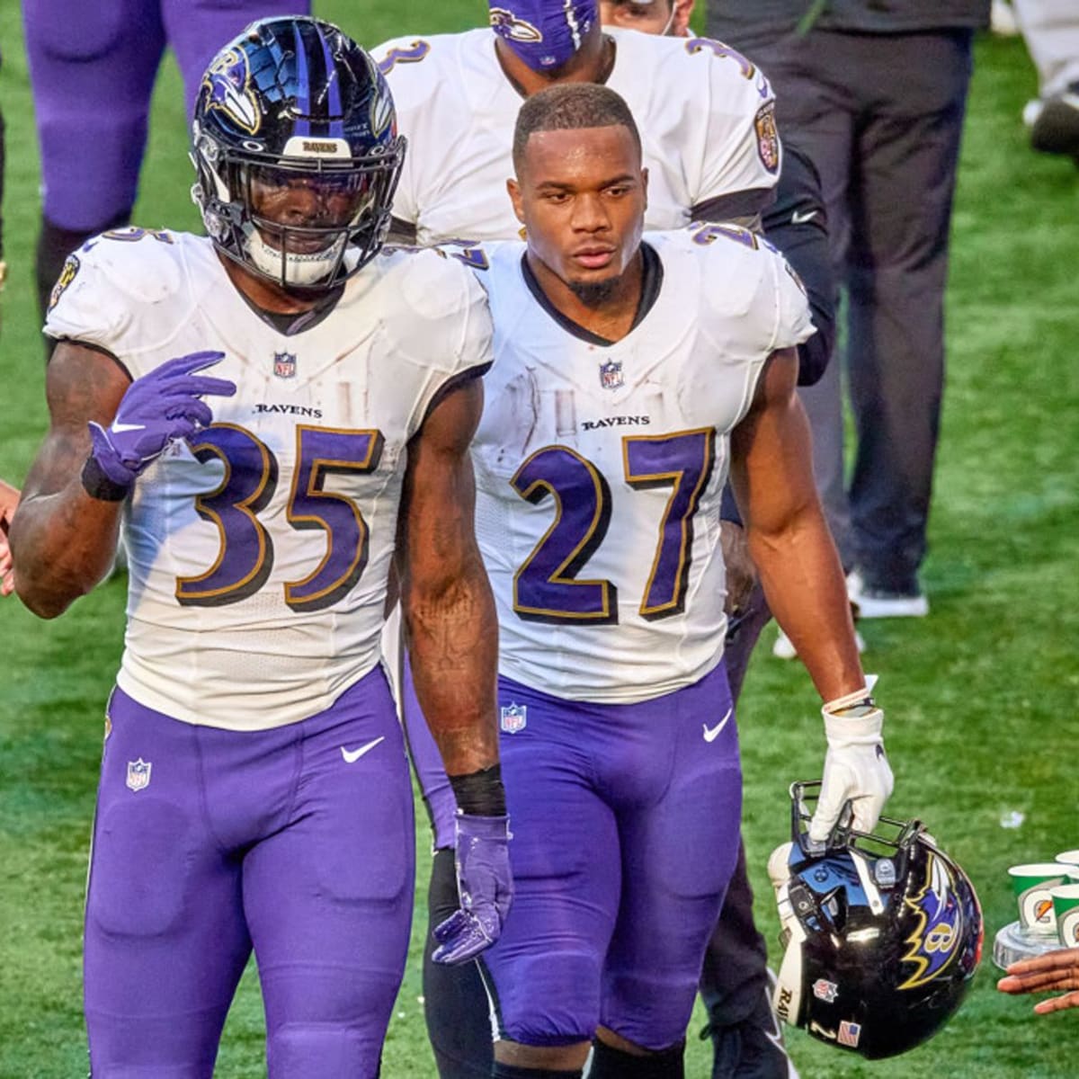 Baltimore Ravens running back Gus Edwards (35) runs with the ball