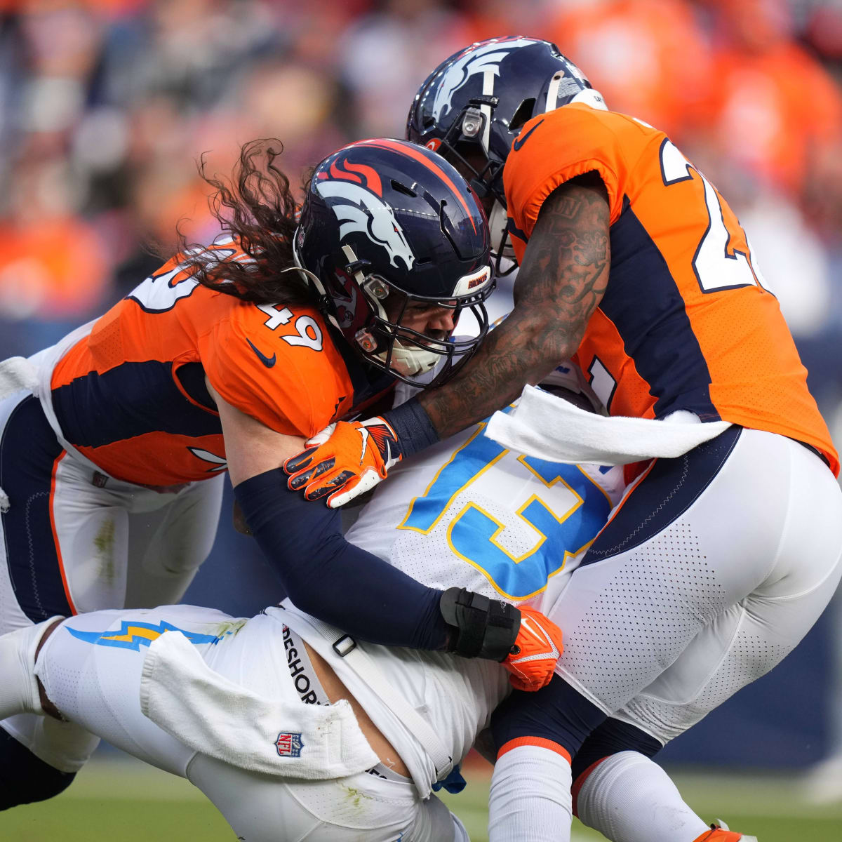 Denver Broncos linebacker Alex Singleton (49) looks into the backfield  during an NFL football game against the San Francisco 49ers, Saturday, Aug  19, 2023, in Santa Clara, Calif. (AP Photo/Scot Tucker Stock