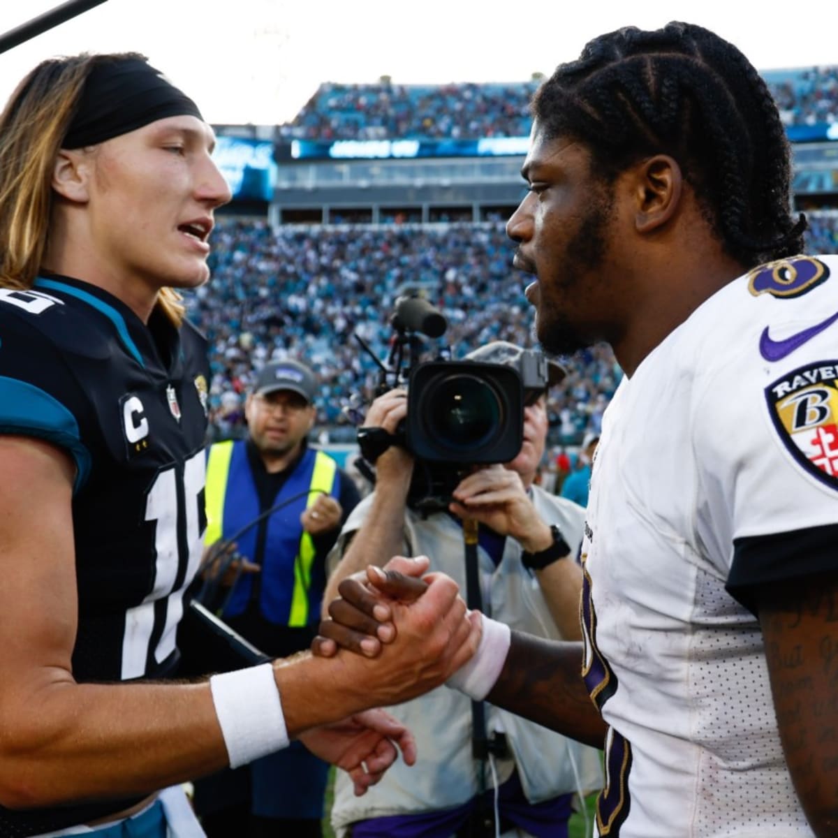 AFC running back Derrick Henry of the Tennessee Titans (22) and quarterback Lamar  Jackson of the Baltimore Ravens (8) during the Pro Bowl, Sunday, Jan. 26,  2020, at Camping World Stadium in