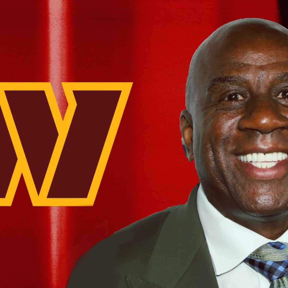 Magic Johnson meets with Washington Commanders players for the